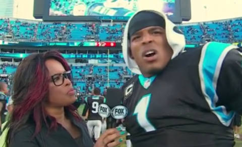 Cam Newton with a funny reaction after being slapped in the butt