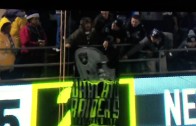 Raiders fan flips the bird at the refs after being told to take down his sign