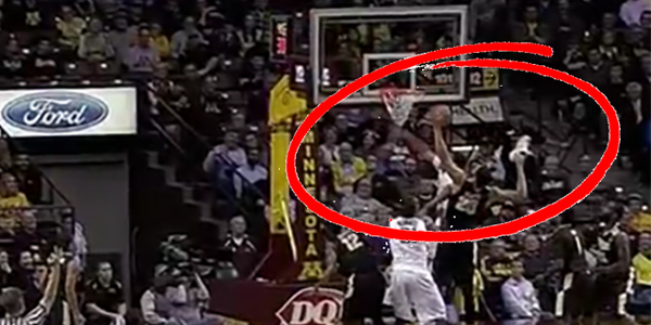 Purdue's A.J. Hammons grabs a rebound with his shoe in one hand