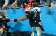Cam Newton tries to steal Buccaneers jersey from fan but falls