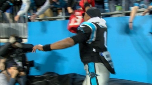 Cam Newton tries to steal Buccaneers jersey from fan but falls