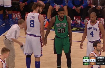 Amir Johnson swats Robin Lopez’s shoe away