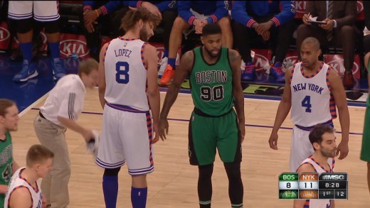 Amir Johnson swats Robin Lopez’s shoe away