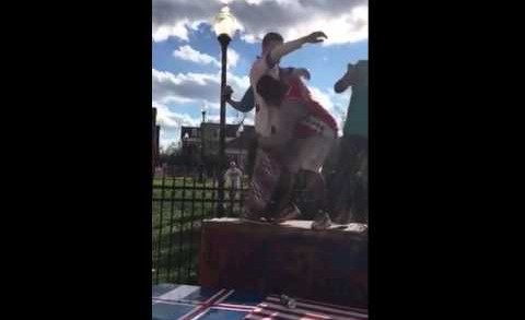 Bills fan with a body slam through a table