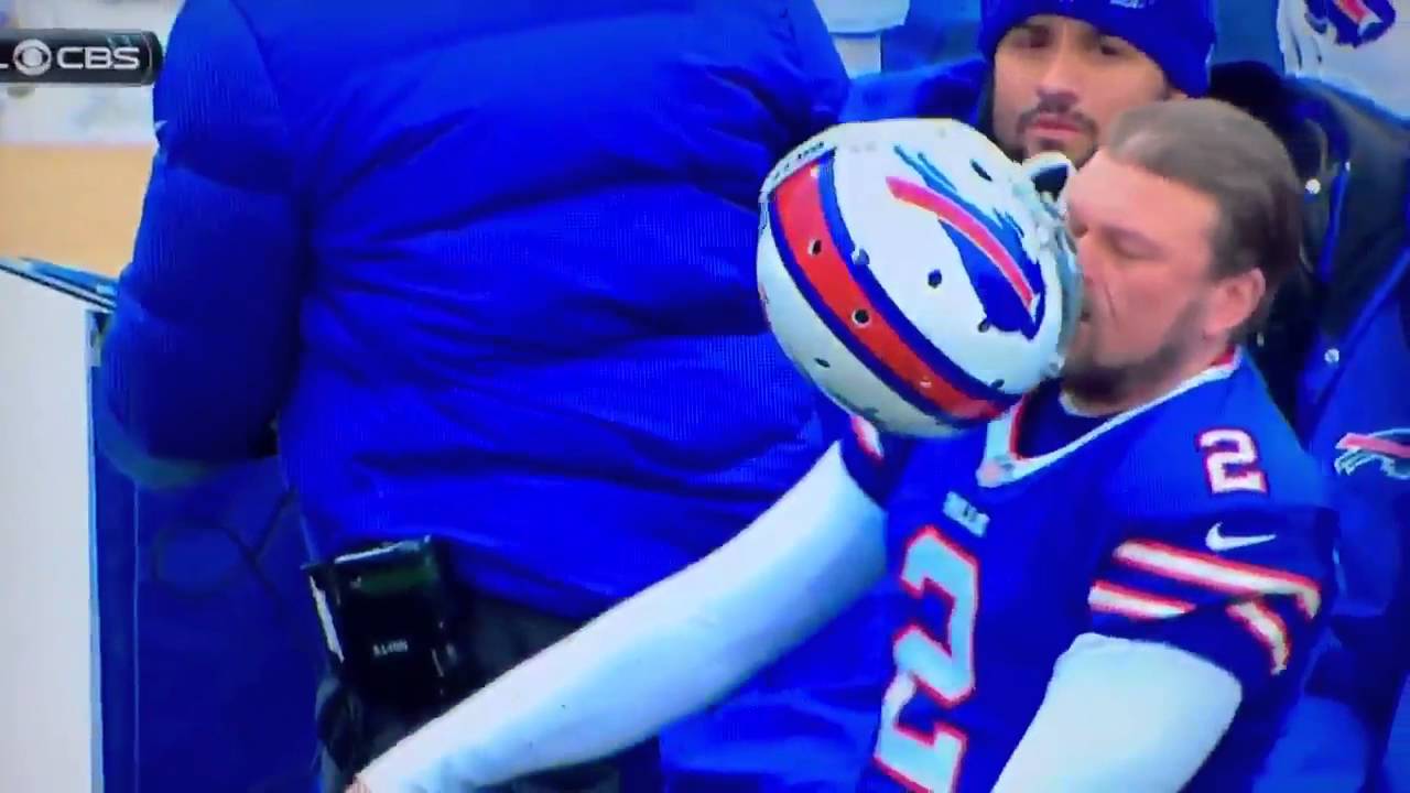 Bills kicker Dan Carpenter hits himself in the face with his own helmet