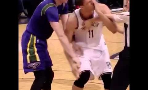 Brook Lopez gets poked in the eye by a ref trying to help