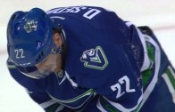 Canucks’ Daniel Sedin takes a puck right in the mouth