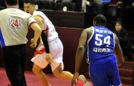 Former NBA player Jason Maxiell chases down a Chinese player to fight him