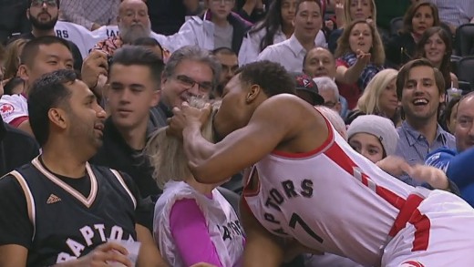 Kyle Lowry kisses a fan after collision