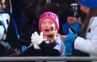 Little girl is estatic after getting a ball from Cam Newton
