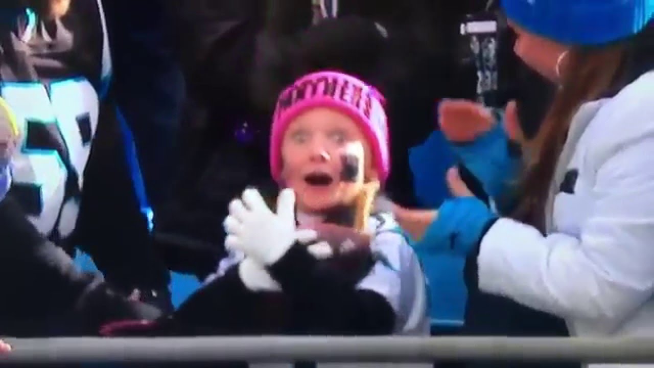 Little girl is estatic after getting a ball from Cam Newton