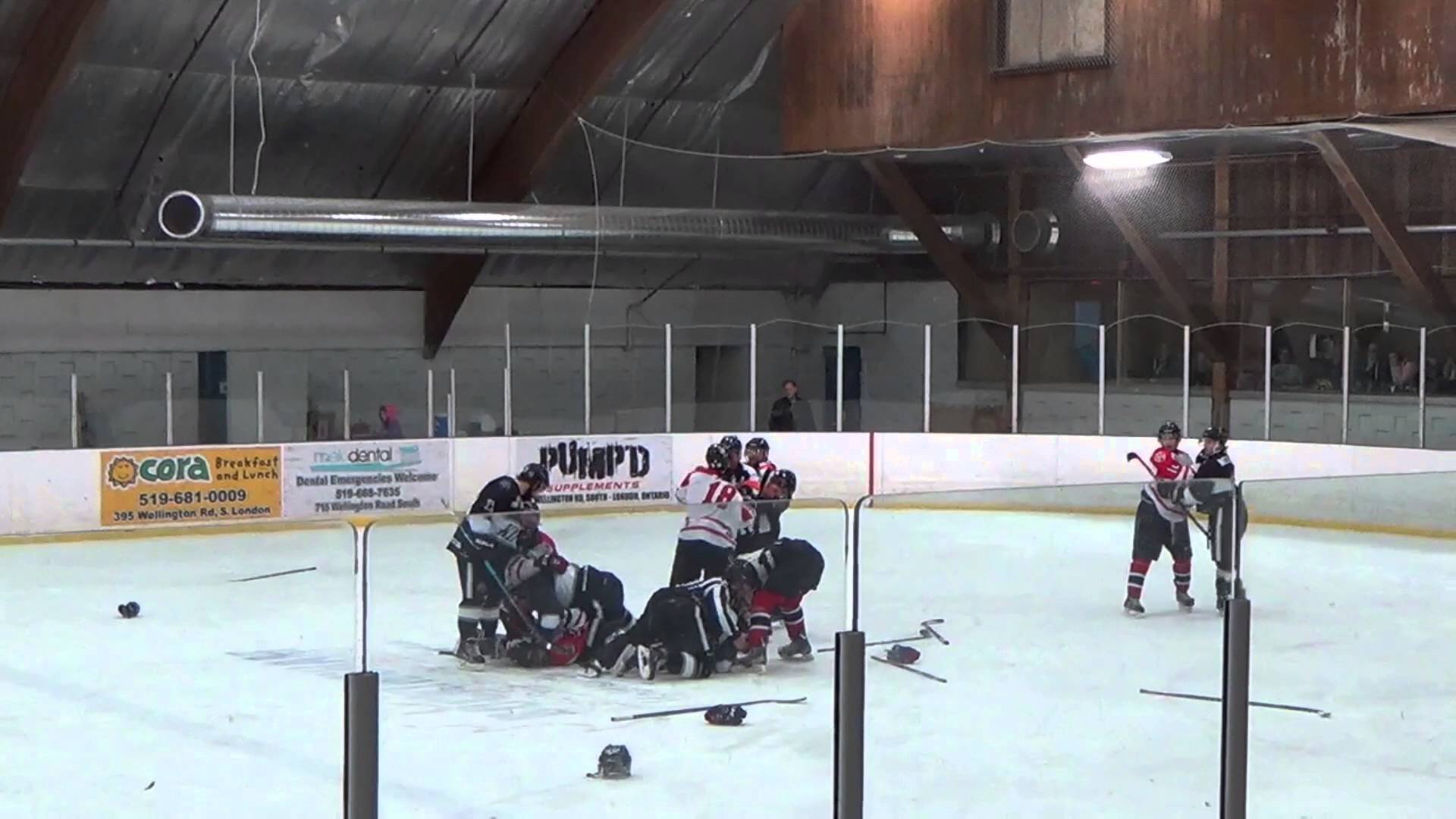 Massive hockey brawl breaks out involving players, refs & trainers