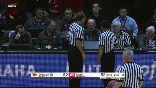 Oregon State player Jarmal Reid trips a referee