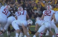 Christian McCaffrey gets tackled by a ref during Stanford vs. Washington