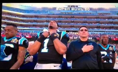 Cam Newton was zoned in hard for the National Anthem