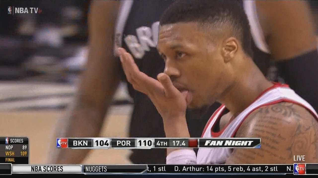 Damian Lillard hits the half court shot after the whistle
