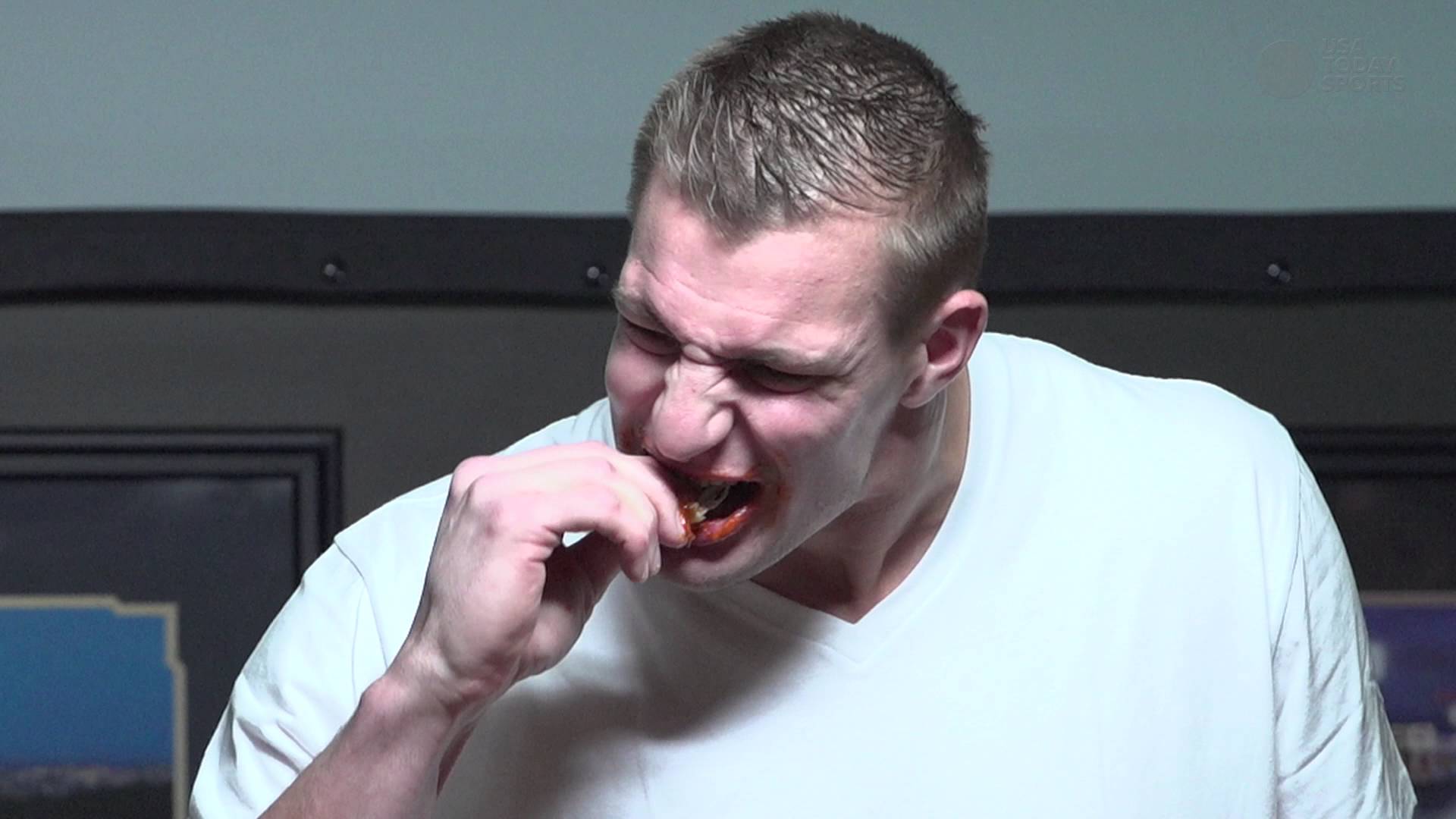 Rob Gronkowski attempts to take down spicy chicken wing challenge