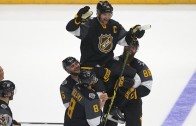 Team Pacific lifts captain John Scott after victory