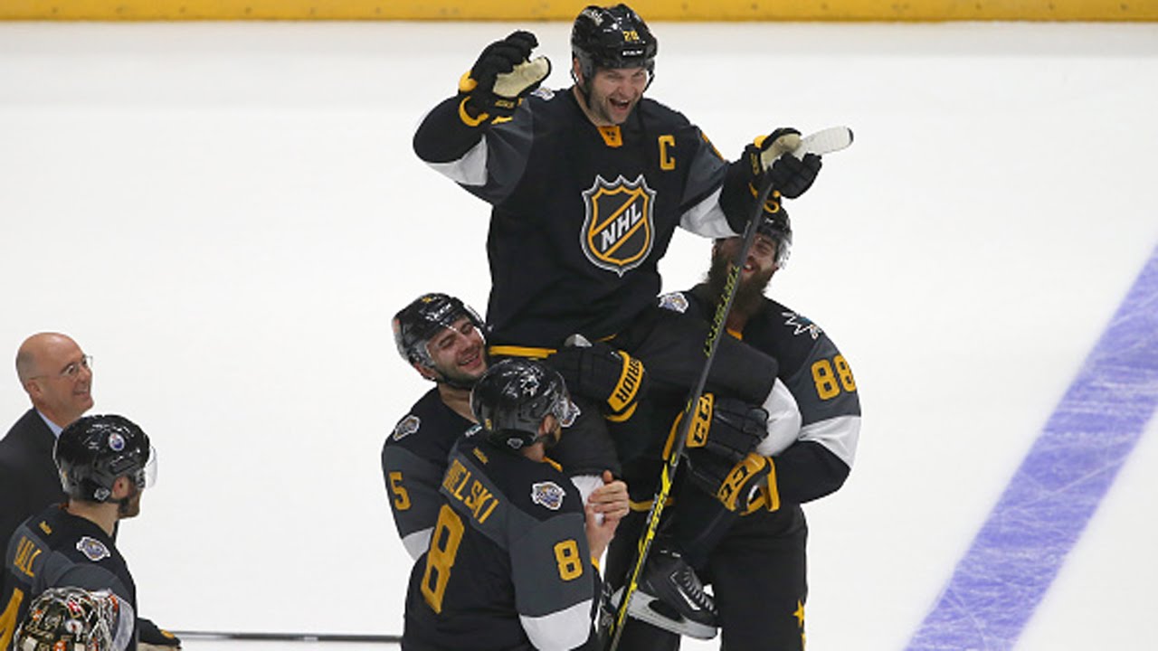 Team Pacific lifts captain John Scott after victory