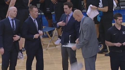 Xaiver head coach Chris Mack punches his clipboard into two pieces