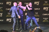 Conor McGregor swings at Nick Diaz in UFC 196 face off