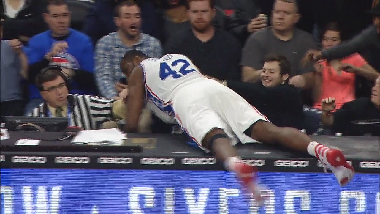 Elton Brand dives into the scorers table for loose ball