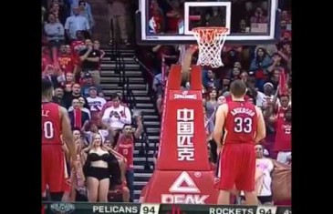 Female Rockets fans flash Ryan Anderson during free throws