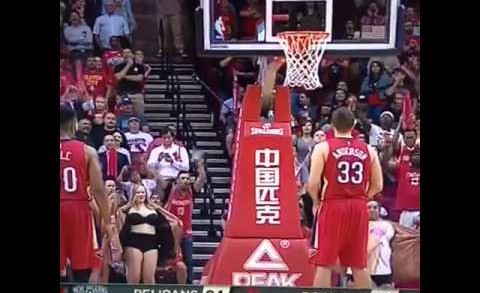 Female Rockets fans flash Ryan Anderson during free throws