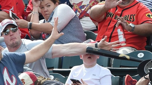 Hero dad saves his son from flying baseball bat