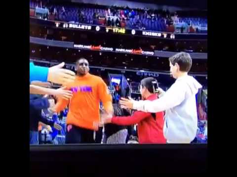 Kevin Seraphin trucks young fan during warm ups