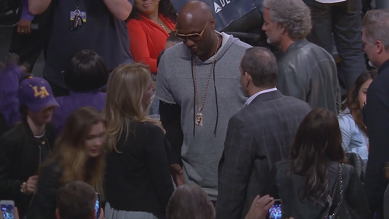 Lamar Odom attends Lakers game & greets Jeanie Buss