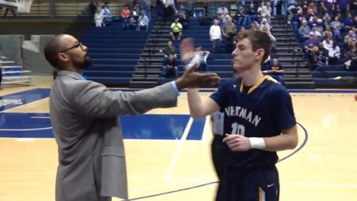 College basketball coach has a cool handshake with all of his players