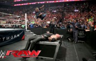 Shane McMahon elbow drops The Undertaker through table
