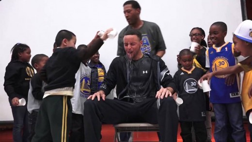Stephen Curry gets cold water dumped on him by Oakland students