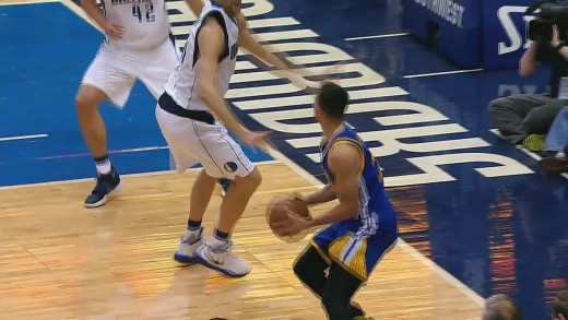 Stephen Curry hits the 3 pointer over Dirk Nowitzki