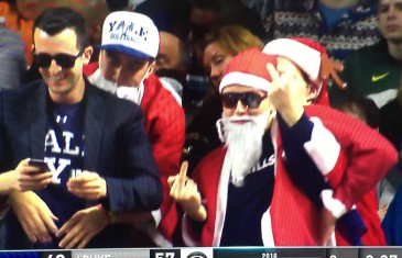 Yale fan dressed as Santa flips middle fingers at Duke