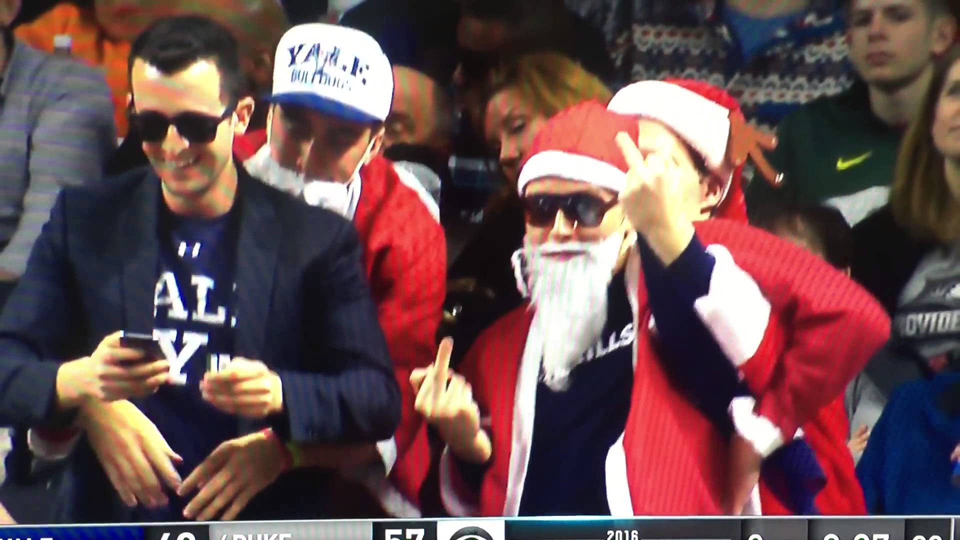 Yale fan dressed as Santa flips middle fingers at Duke