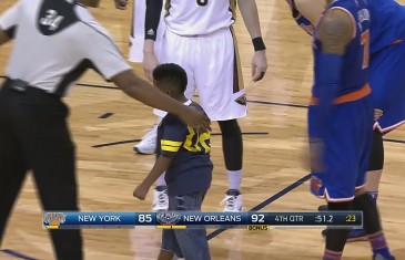 Young kid runs on the court to hug Carmelo Anthony