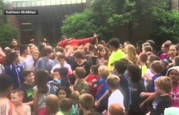 Cam Newton hits the dab with school yard full of kids