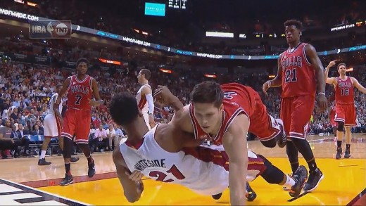 Doug McDermott literally tackles Hassan Whiteside