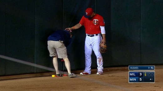 Minnesota Twins staff bring out the duct tape to tape outfield wall