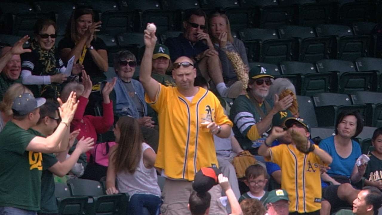 Oakland A's fan snags foul ball while holding his beer