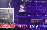 Shane McMahon elbow drops The Undertaker through table