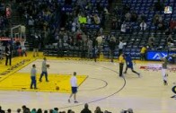 Stephen Curry hits half court shots during pre-game warmups