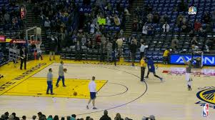 Stephen Curry hits half court shots during pre-game warmups