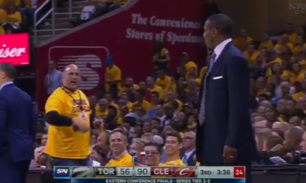 Dwane Casey goes at it with a Cavs fan on the sidelines
