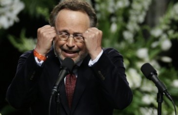 Billy Crystal with a spot on imitation of Muhammad Ali at his funeral