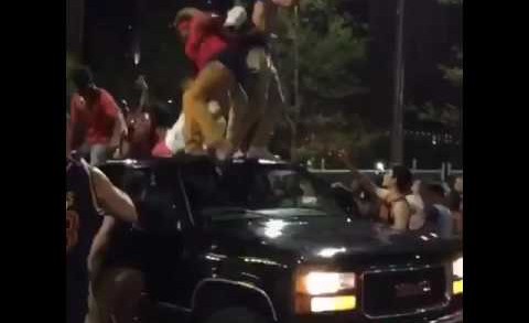 Driver knocks off Cavaliers fans jumping on his truck