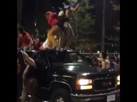 Driver knocks off Cavaliers fans jumping on his truck