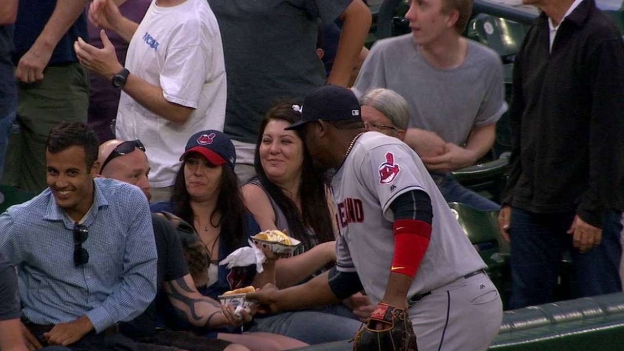 Juan Uribe pretends to go for a fan's hot dog